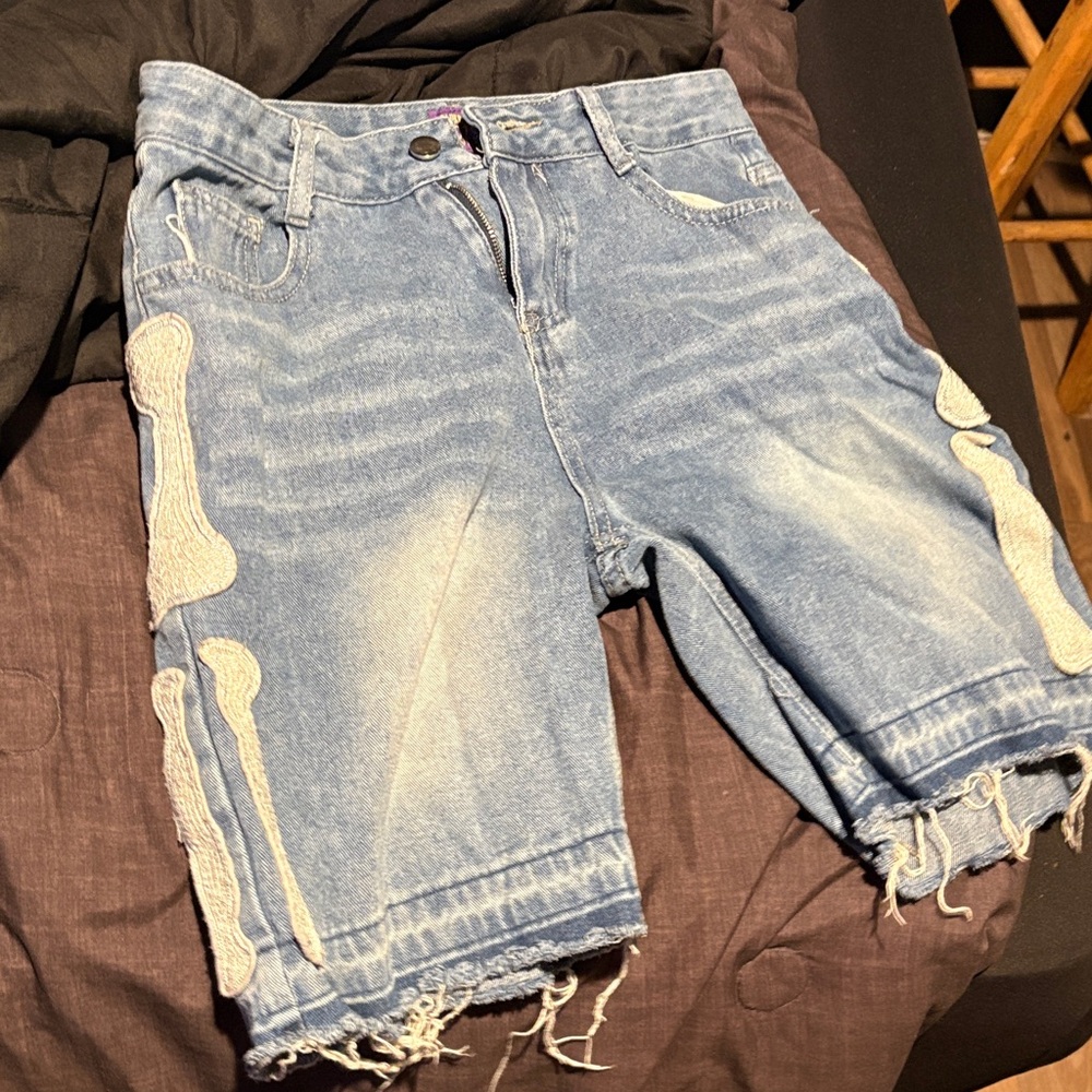 Distressed Denim Shorts with Bone Design